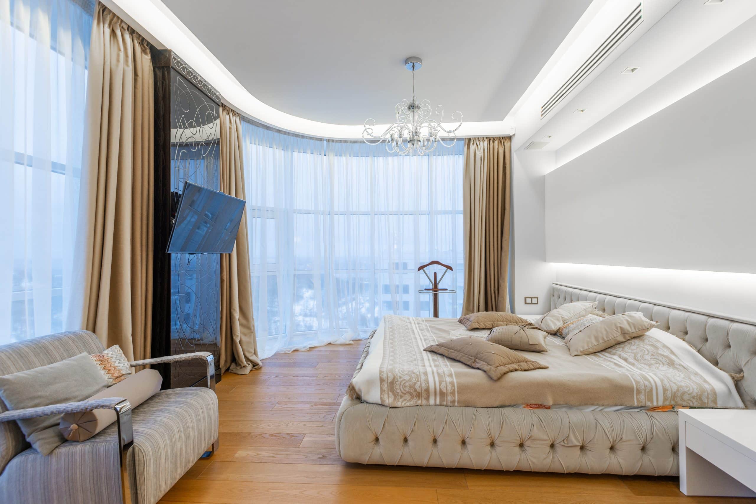 Luxury Bed in a big room with two big window