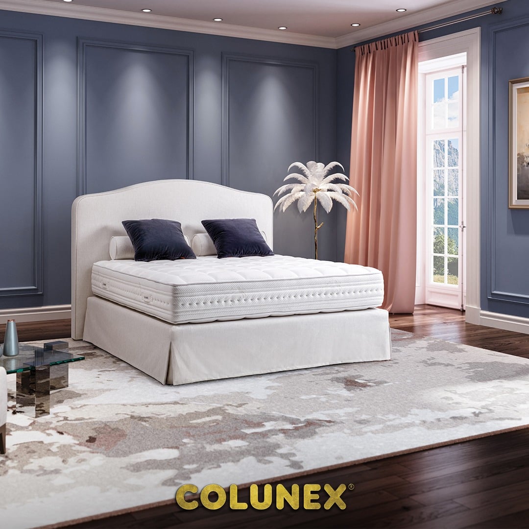 Colunex bed in a blue room with wood floor